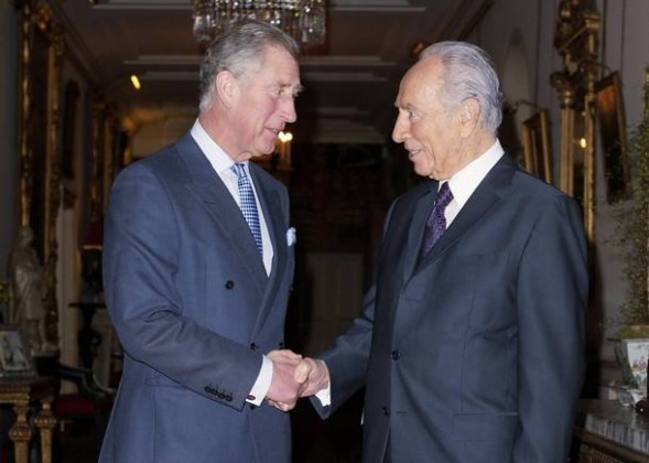 Britain's Prince Charles (L) receives Israel's President Shimon Peres with a firm Masonic grip at Clarence House in London November 20, 2008